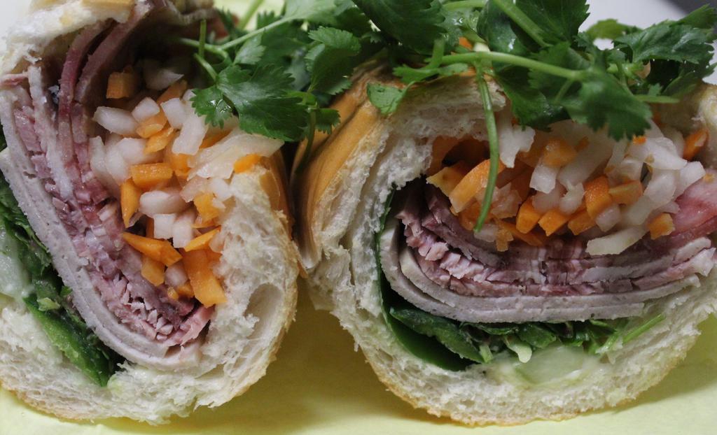 Ham, Pate, Head Cheese - Banh Mi Thit Nguoi · Vietnamese Ham, Pate, and Head Cheese slices. The OG of Banh Mi's. With Vietnamese mayo, cilantro, jalapenos, pickled daikon, and carrot!