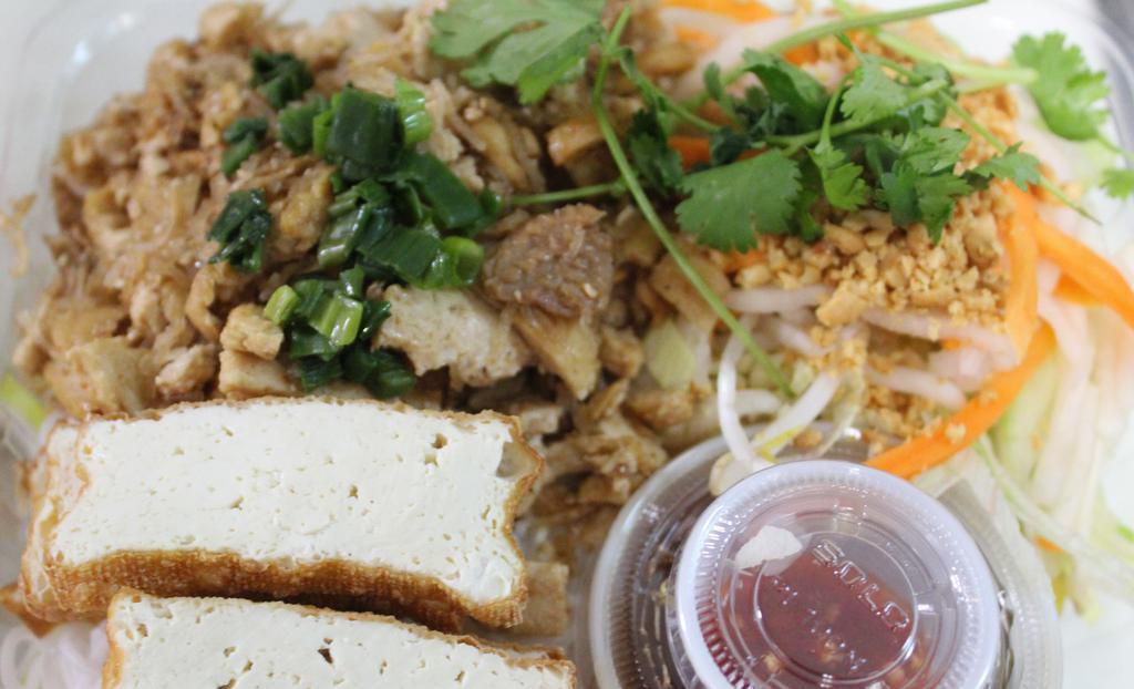 65. Vegetarian Tofu Vermicelli (Bun Chay)  · Our vegetarian tofu is the best! It is served with our house made stir fry tofu, and fried tofu pieces on a bed of vermicelli with pickled veggies, green onions, and a side of fish sauce!