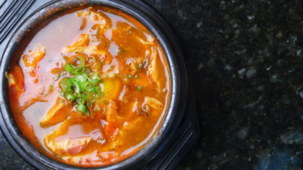 Sundubu · Soft tofu soup with egg (beef, seafood or vegetable). Comes with rice and side dishes