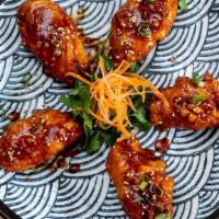 R3. Sweet and Spicy Chicken Wings · Marinated with ginger, garlic and house - special sweet-spicy sauce.