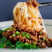 M2. Sichuan Dan Dan Noodles · Spicy hot and world-famous topped with caramelized and crispy ground pork, bok choy and pean...