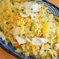 F1. Singapore Curry Chicken Fried Rice · Chicken breast, pineapple, peas, and carrots with yellow curry.