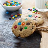 M&M's Cookie Ice Cream Sandwich · Fresh baked cookie dough with loads of M&M's filled with premium vanilla ice cream for a dec...