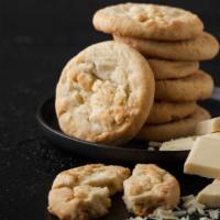 White Chocolate Chip & Macadamia Nut Cookie Buttercream Sandwich · Fresh baked cookie dough with loads of white chocolate chips and buttery macadamia nuts fill...