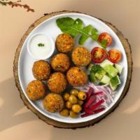 Spicy Falafel · Six pieces of crispy spicy garbanzo beans marinated in homemade spices.