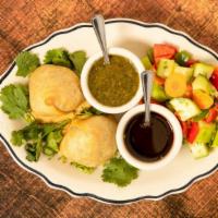 Aroma Special Veg Samosa · Two pastry sheets stuffed with roasted cumin, potatoes and peas.