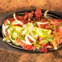 Tandoori Chicken -8 Pieces · Country style (country chicken) chicken fully cooked in Tandoor with overnight marinated pro...