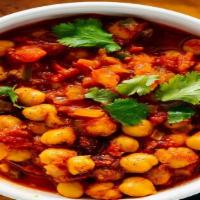 Chana Masala · Chickpeas cooked in a spicy and
tangy tomato sauce.