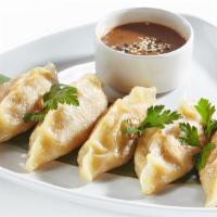 Chef's Chicken Momo Platter · Fresh momo platter with steamed, deep-fried, pan-fried and tandoori momos. Served with chef'...