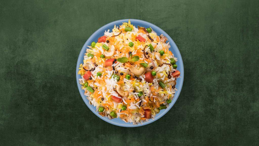 Veggie Biryani · Aromatic basmati rice cooked with vegetables and fresh herbs, spices and cooked in a special homemade biryani masala.