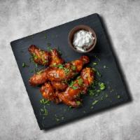 Wings (6 pcs) · Bone-in traditional chicken wings in a choice of buffalo, sweet chili garlic or our signatur...