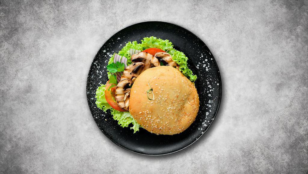 Mushroom Swiss Burger · 1/3 lb. patty made to order with lettuce, red onion, tomatoes, mayo, ketchup, mustard, mushrooms, and Swiss cheese.