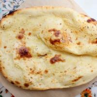 Garlic Naan · Tandoor baked white flour bread garnished with freshly minced garlic.