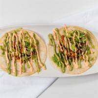 Spicy Pork Tacos (Set of 2) · Thin Slices of Spicy Tender Pork Marinated in a Hot and Sweet Sauce, topped with lettuce, Ti...