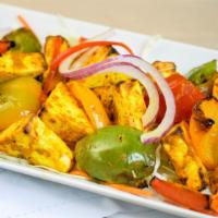 Paneer Tikka · Farmer’s cheese marinated in spices and roasted in tandoor.