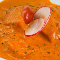 Chicken Tikka Masala · Chicken breast pieces roasted in tandoor and cooked in tomato and cream sauce.