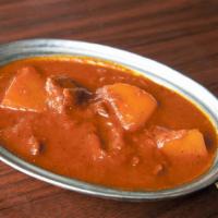 Chicken Vindaloo · Classic chicken curry cooked in hot and tangy spicy sauce with potato.