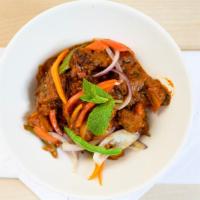 Karahi Gosht · Stir fried lamb cooked with bell pepper onion tomatoes and spices.