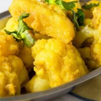 Aloo Gobi · Potatoes and cauliflower cooked with spices