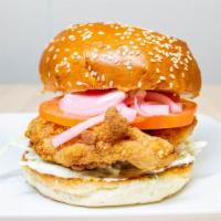 Crispy Chicken Sandwich · Hand battered boneless chicken thigh served on a sesame seed bun with a spicy herb aioli, pi...