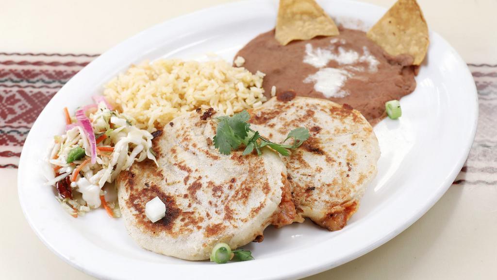 Pupusas De Chipotle (2) · A popular salvadorian dish! pupusas are similar to corn tortillas and filled with beans. Cheese, and spicy chipotle chilies. Served with rice, refried beans and a side of spicy cabbage.
