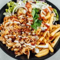 Chicken Shawarma Plate · Seasoned slowly roasted chicken shaved thinly, and served with lettuce, tomatoes, parsley, o...
