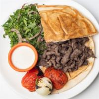 Lamb Shawarma Plate · Seasoned slowly roasted lamb shaved thinly, and served with lettuce, tomatoes, parsley, onio...