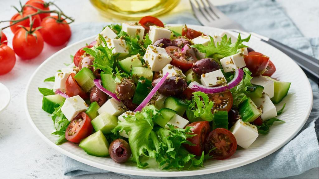 Mediterranean Salad · Fresh diced tomatoes, red onions, cucumbers and parsley dressed with fresh lemon juice and olive oil.