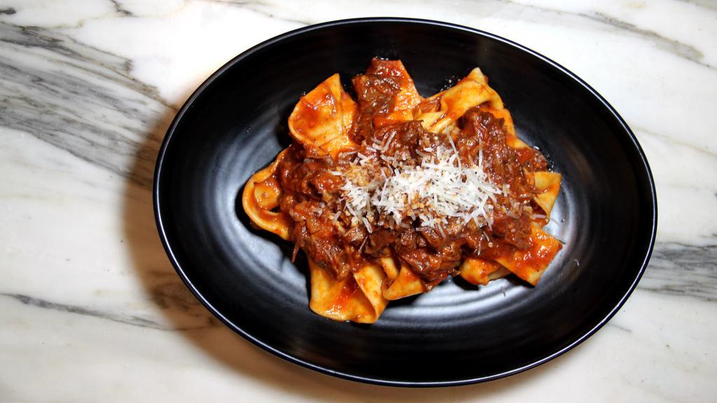 Coda Alla Vaccinara · Home-made pappardelle, slowly cooked oxtail ragu.