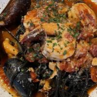 Seafood Pasta · Squid ink noodles, chopped clams, shrimp, mussels, and tomato fennel sauce.