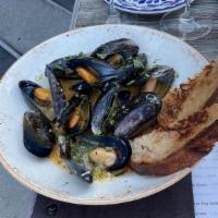 Steamed Mussels & Toast · steamed mussels, white wine, butter, garlic, shallots, calabrian chilis, served with levain ...