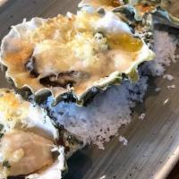 Butter Roasted Oysters · Garlic Butter and Grana Padano.