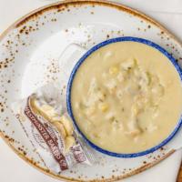 New England Clam Chowder · Clams, potatoes, bacon, and corn.