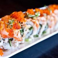 Pink Dragon Roll · Toasted salmon over crab salad and avocado with tobiko, green onion, spicy mayo, and eel sau...