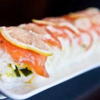 Niner Roll · Avocado, cucumber in soy paper topped with salmon and lemon.
