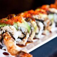 Dragon Roll · Tempura shrimp topped with eel, avocado and tobiko with eel sauces.