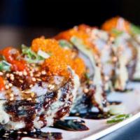 Dynamite X Roll · Fried spicy tuna and avocado with spicy eel sauces, tobiko and green onion.