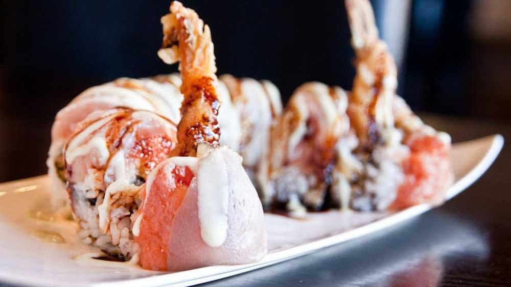 Scorpion Roll · Tempura shrimp topped spicy tuna and seared albacore with eel sauce and spicy mayo.