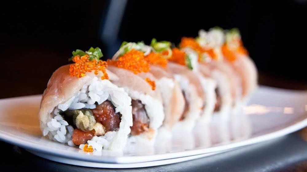 Godzilla Roll · Tempura, asparagus and spicy tuna topped with albacore and tobiko with green onion and ponzu.