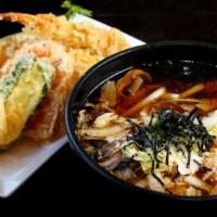 Tempura Udon · Noodles soup with shrimp and vegetables tempura on side.