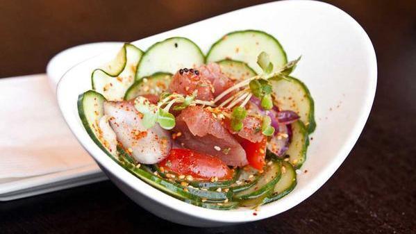 Salmon Poke · Seaweed salad, onion and cucumber with spices in vinegar dressing.