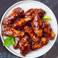 BBQ Bliss Wings  · Deep-fried wings tossed in BBQ sauce, served with a side of ranch dressing.