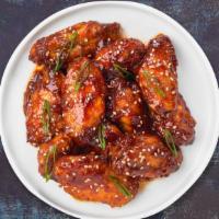 Tricky Teriyaki Wings  · Deep-fried wings tossed in Asian teriyaki glaze, served with a side of ranch dressing.