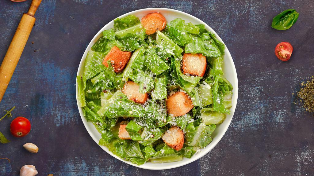 Reign of Caesar Salad · Romaine lettuce, croutons, shaved Parmesan cheese, caesar dressing.