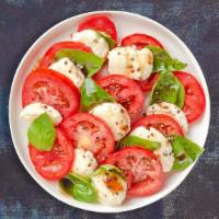 Call Me Caprese Salad · Fresh Mozzarella, tomato, and basil topped with extra virgin olive oil.