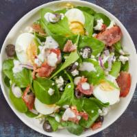 Spinach Revolution Salad · Spinach, fresh diced tomatoes, red onions, dried cranberries, feta cheese, raspberry vinaigr...