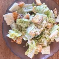 Caesar Salad · Organic romaine lettuce with caesar dressing, croûtons, and Parmesan cheese.