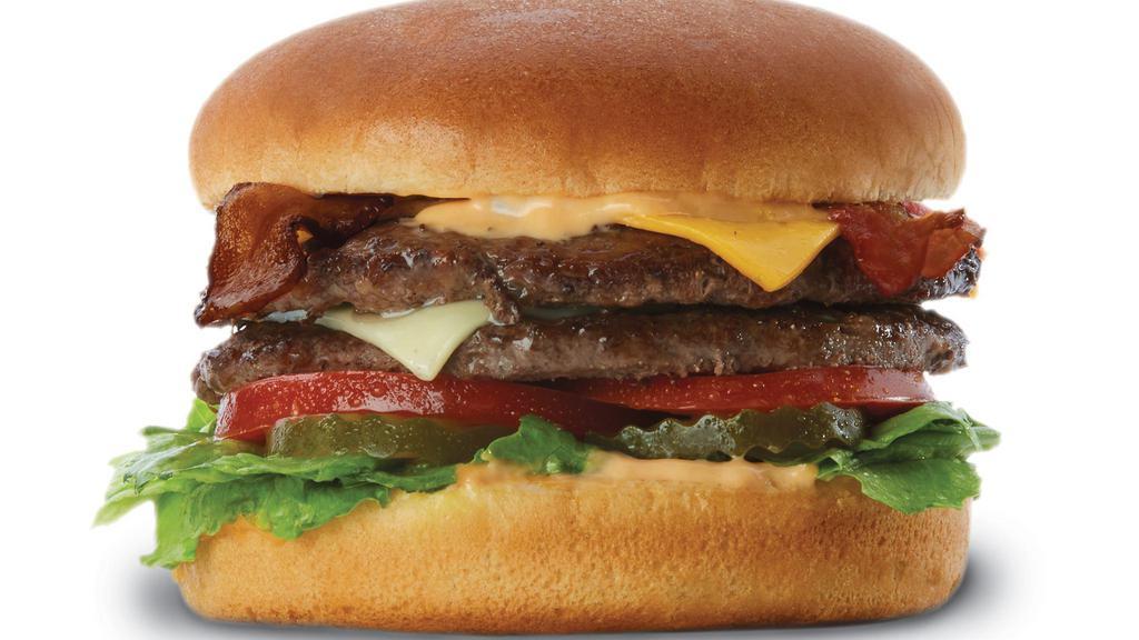 The Double Decker™  Burger · Two of our quarter pound patties stacked high with sauce, pickle. Lettuce, tomato, Swiss and American cheese, and bacon.