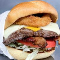 The Big Boss™  Burger · Our quarter pound burger stacked with sauce, pickles, lettuce, tomato, Swiss and American ch...