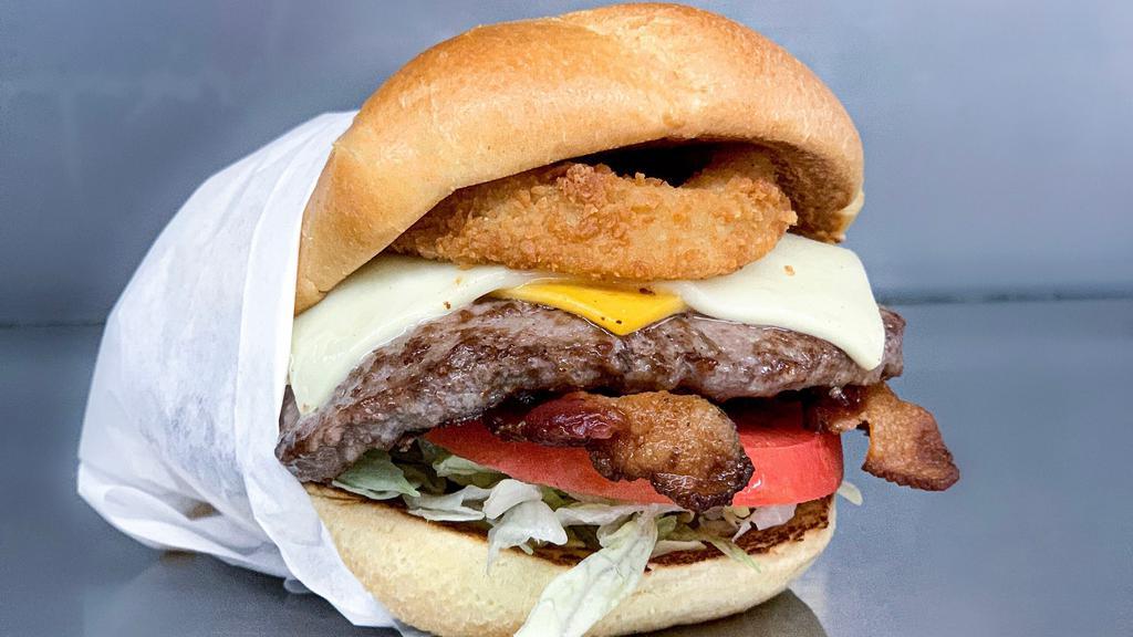The Big Boss™  Burger · Our quarter pound burger stacked with sauce, pickles, lettuce, tomato, Swiss and American cheese, bacon, and two onion rings.